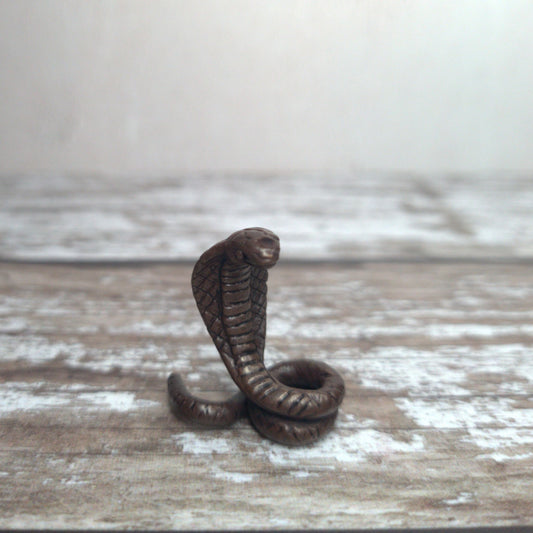 Miniature foundry-cast bronze cobra sculpture with dark patina by David Meredith at Alcove Art